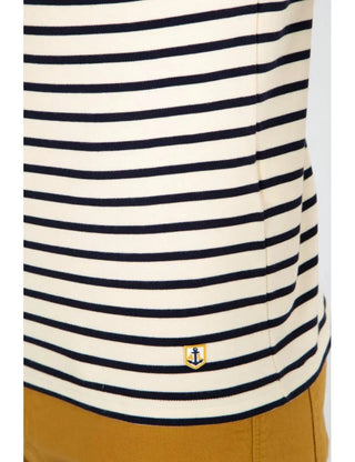 Navy and white striped cotton Breton shirt with small anchor patch above mustard pants.