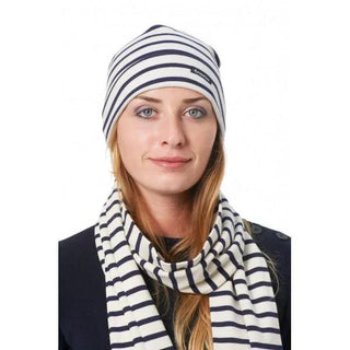 Woman wearing a navy and white striped cotton beanie and matching scarf