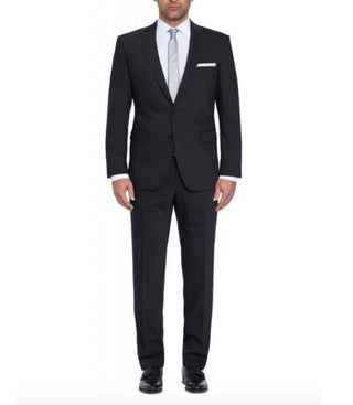 Man wearing black two-piece suit with white dress shirt and light grey tie on white background