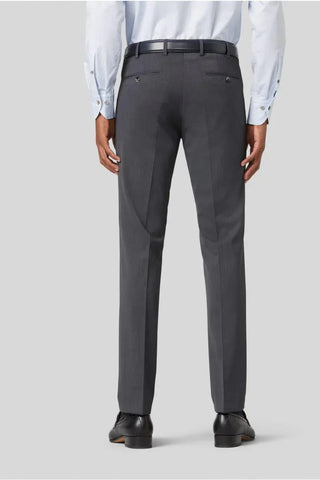 Back view of man wearing grey wool dress pants, black belt, light shirt, and dress shoes