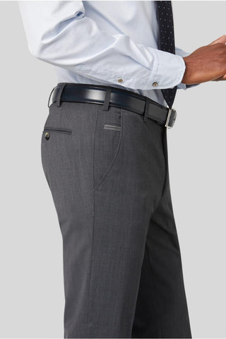 Man wearing grey wool dress pants with black belt and light blue dress shirt